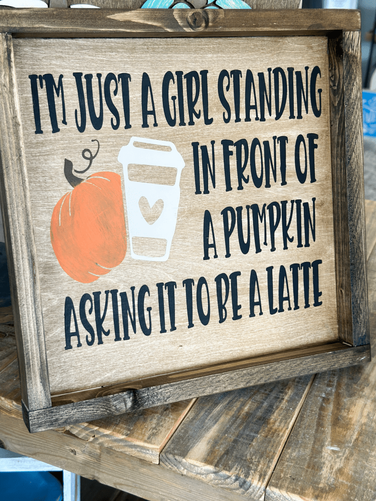 just a girl standing in front of a pumpkin