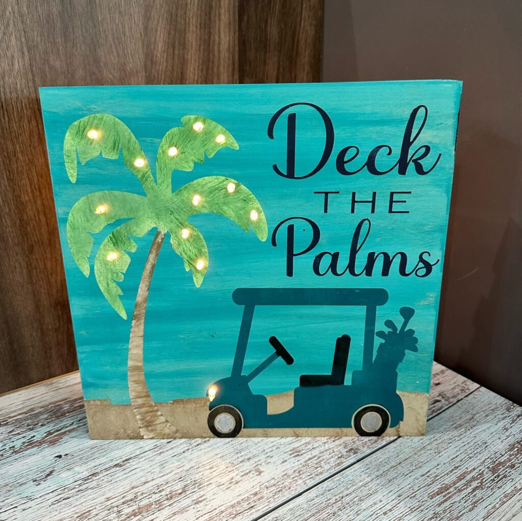 Deck the Palms lighted sign