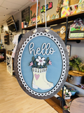 hello- scalloped oval sign with rainboots